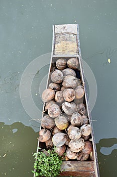 AMPHAWA Ã¢â¬â APRIL 29: Wooden boats are loaded with fruits from the orchards at Tha kha floating market